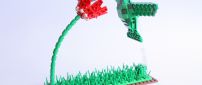 A green bird on the flower - Art made of lego