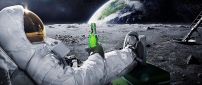 A men in space with a carlsberg beer