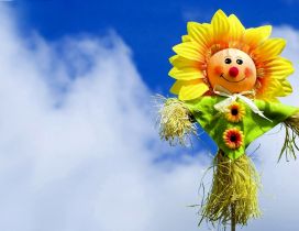 Scarecrow made of flower and straw in the sky