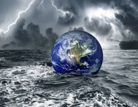 The Earth floats on the water in a stormy day