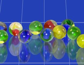 Many colored balls reflected in the blue mirror