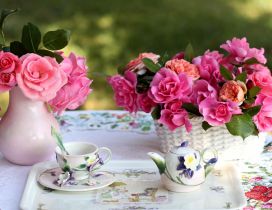 A bright morning with hot tea between flowers