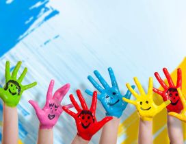 Happy colorful hands - Smiley face on the hands
