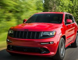 Red Jeep Grand Cherokee SRT8 on road