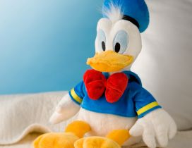Donald Duck, plush toy on the sofa