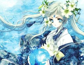 An anime girl with a crystal globe and flowers in hair