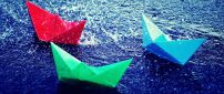 Three paper boats on the water - HD image