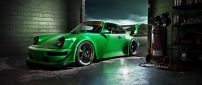 Green Porsche Carrera in a garage - Sports car