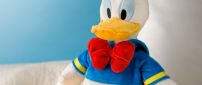 Donald Duck, plush toy on the sofa