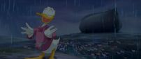 Donald Duck standing in the rain at night