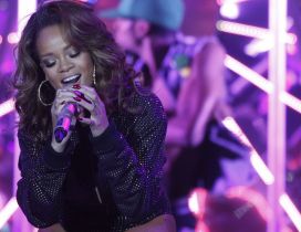 Rihanna sings in a concert - Singer wallpaper