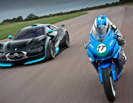 Blue and black Citroen and blue motorcycle race