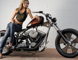 A girl on the Harley Davidson Classic Bobber motorcycle