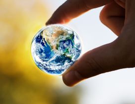 A small earth globe - The world in our hands