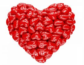 A big 3D heart made of many small red hearts