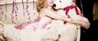 Kylie Minogue with a white plush bear