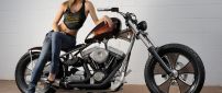 A girl on the Harley Davidson Classic Bobber motorcycle