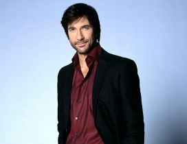 Dylan McDermott in black and red