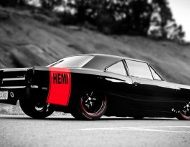 Beautiful black Hemi car on road