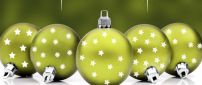 Green Christmas balls full with stars - Happy winter holiday