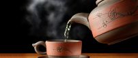 Hot tea in special brown cup - HD wallpaper