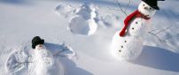 Funny snowmen play in the snow - HD white winter wallpaper