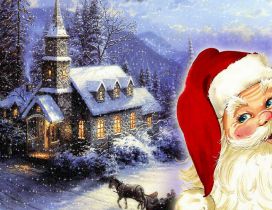Santa Claus and a village on the Christmas night
