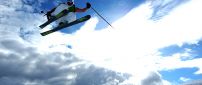 Skiing jumps on a beautiful sunny winter day