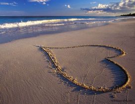 Heart on the sand at the beach - Love you