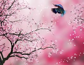 Bird dancing through the spring flowers