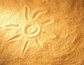 Sun painted on the golden beach sand