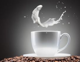 Milk splash in a cup of coffee - Good morning