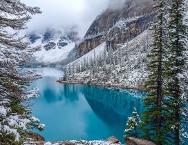 Wonderful blue mountain lake in the winter season
