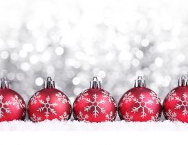 Five red Christmas ball on a silver background