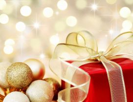 Golden ribbon and Christmas ball - Happy Winter Holiday