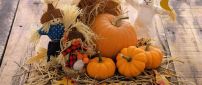 Funny scarecrow and Halloween pumpkins