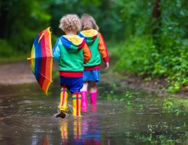 Colorful Autumn clothes for happy children -Play in the rain