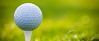 Small golf ball on the green field - HD sport wallpaper