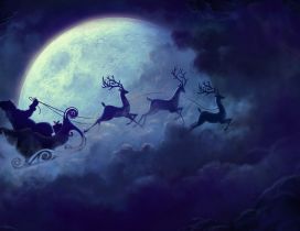 Santa Claus flying on the sky with the deers -Christmas time
