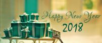 Green boxes with presents for a new beginning - Happy 2018