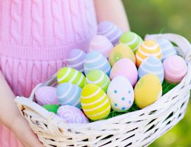 Girl with a basket full with Easter eggs - Happy Holiday
