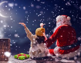 Magic time with Santa Claus on the roof - Christmas holiday
