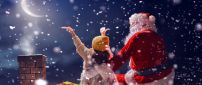 Magic time with Santa Claus on the roof - Christmas holiday