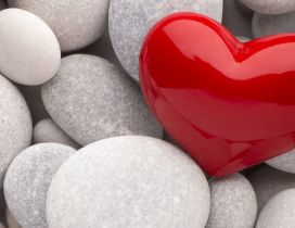 Big red heart near grey rocks - Love wins Valentines Day