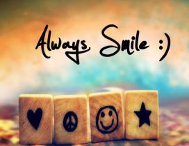 Always smile - Funny symbols on small wooden cubes