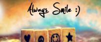 Always smile - Funny symbols on small wooden cubes