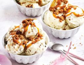 Delicious hot cross bun caramel and vanilla ice cream desert