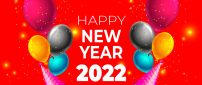 Colorful balloons and confetti for a Happy new year 2022