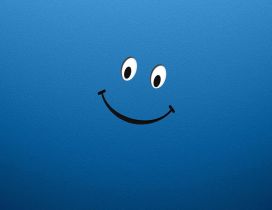 Two eyes and a happy smile face on a blue background